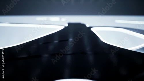 A slow crane video over a polished white surface tracks a deep-dark abstract pathway with cool white luminescence, forming and curving precisely, symbolizing clear objectives and forward momentum