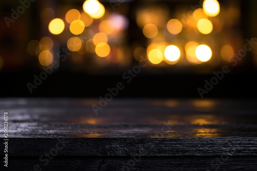 Dark Wooden Table Background With Warm Blurred Bokeh Lights