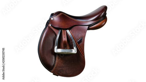 Bild auf Leinwand Brown leather jumping saddle with silver stirrup