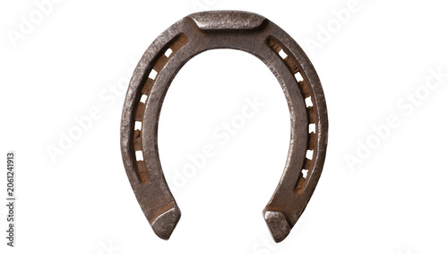 Rusty metal horseshoe with nail holes