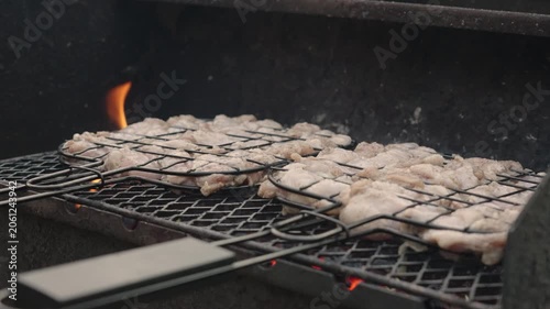 Fresh marinated meat grilling over hot charcoal and open flame