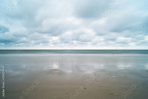 Minimalist and abstract long-exposure shot (30s) of the North Sea at the West Beach of Amrum, looking towards England