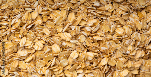 Foto Oat flakes textured pattern, rolled oatmeal macro background