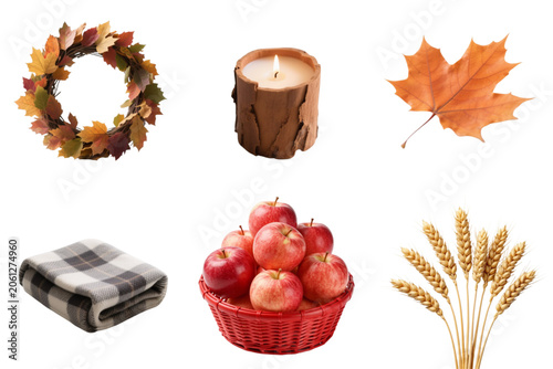 Autumn decorations with apples, leaves, blanket, and candle  