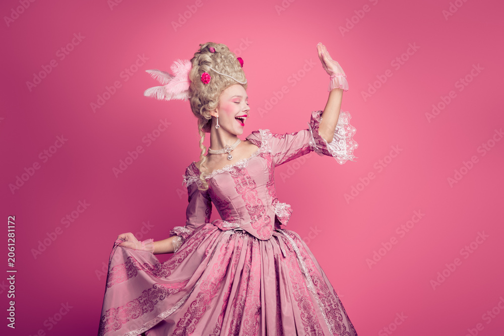 Fototapeta premium Photo of attractive carefree lady dressed baroque costume waving arm hi copy space isolated pink color background