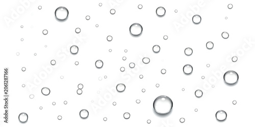 Clear water droplets and liquid bubbles scattered across a clean surface
