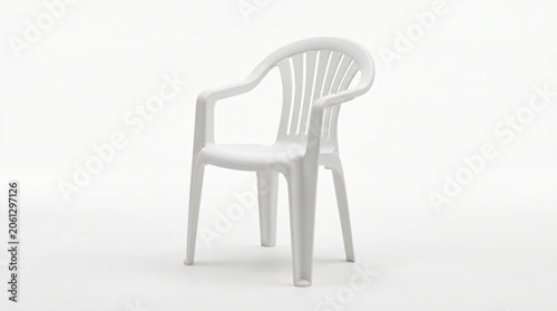 Simple white plastic garden chair with armrests and a curved backrest isolated on a plain clean studio background for outdoor seating furniture concepts captured in bright and even soft lighting.