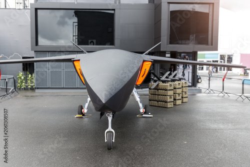 Canvastavla Front view advanced unmanned aircraft uav missile carrier outdoors wet pavement cloudy sky