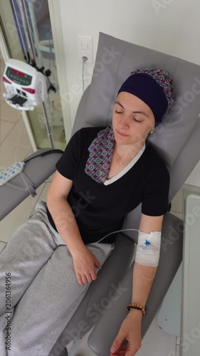 Cancer patient seated in treatment chair during infusion session highlighting perseverance resilience and hope throughout medical recovery process