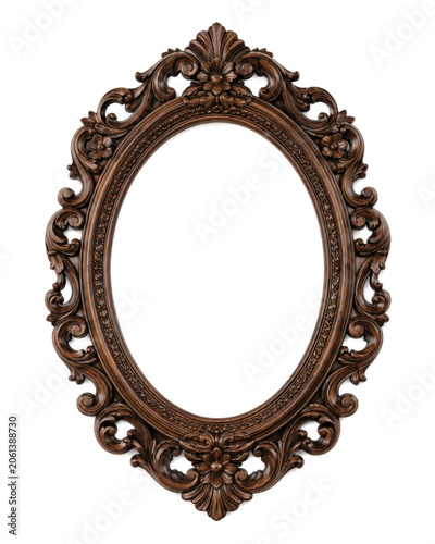 Obraz na plátne Elegant antique oval wooden picture frame isolated on a white background, featuring intricate baroque floral carvings, decorative scrollwork, and rich dark walnut wood texture