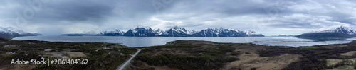 Drone footage overlooking the cloudy Lyngen Alps and the Lyngenfjord in the Troms region, Northern Norway