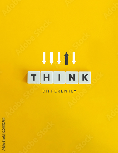 Think differently concept with upward arrow standing out