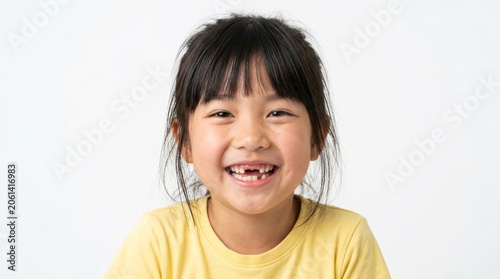 Young girl smiling and showing a gap from tooth removal and missing teeth.