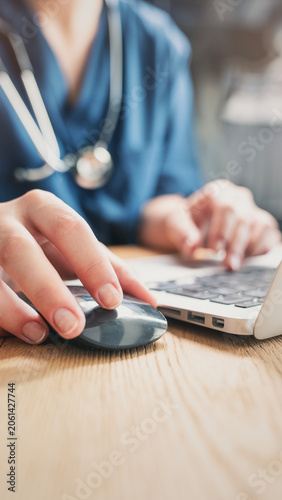 Healthcare professional working on patient documents