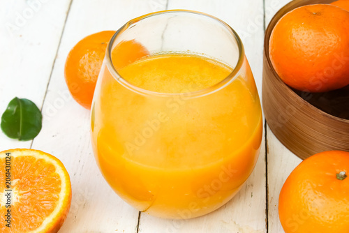 Slika na platnu a glass of orange juice on a wooden table