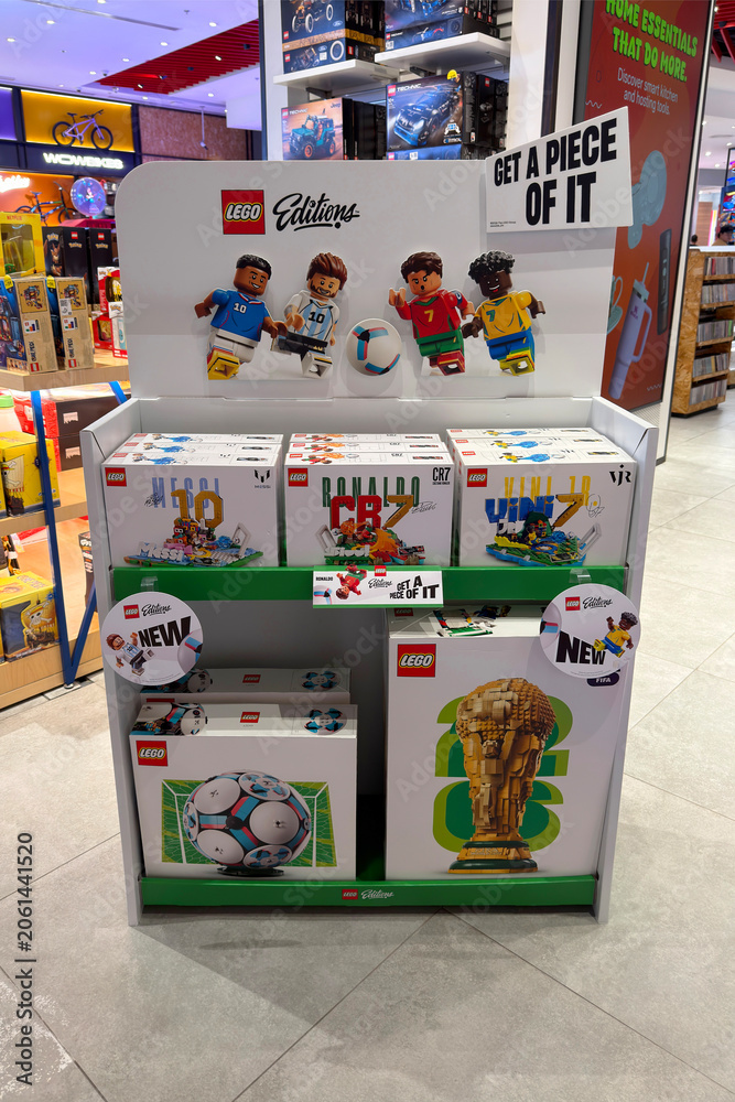 Naklejka premium Dubai, UAE - 24 may 2026: LEGO football themed construction sets featuring famous players and FIFA World Cup display arranged inside toy store, highlighting sports merchandise and retail promotion