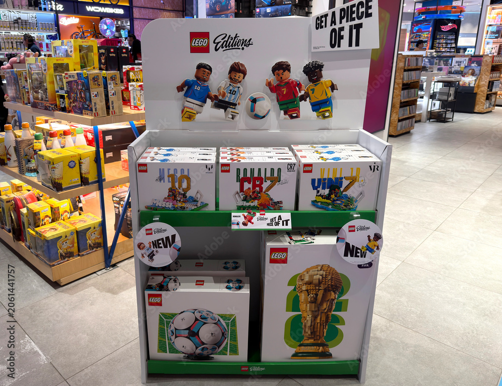 Naklejka premium Dubai, UAE - 24 may 2026: LEGO football themed construction sets featuring famous players and FIFA World Cup display arranged inside toy store, highlighting sports merchandise and retail promotion