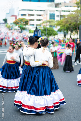 Foto Young girls wearing traditional costumes performing during a cultural festival parade