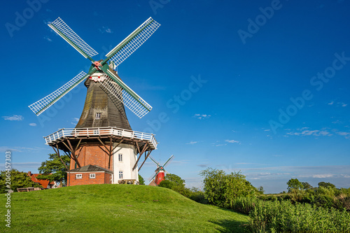 Schilderij op canvas Greetsiel, East Frisia, Germany - The historic twin mills in Greetsiel