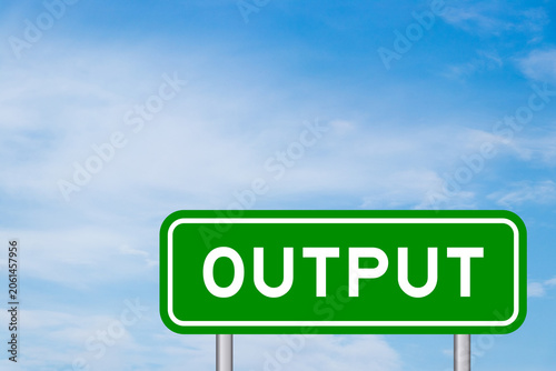 Green color transportation sign with word output on blue sky with white cloud background
