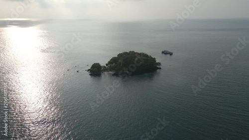 Tranquil Aerial Over Lush Green Islet And Glittering Sea Lampung