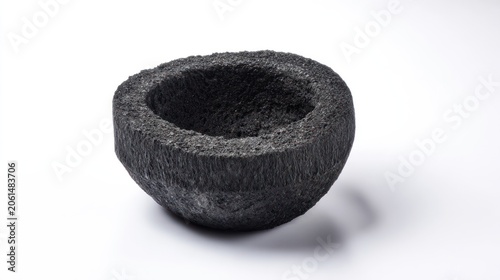 Close up of a charcoal colored bowl against a bright white background