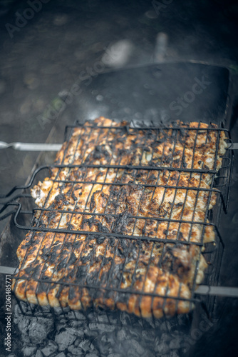 chicken kebab is cooked on coals