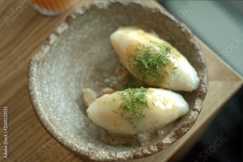 Photos Lithuanian national dish - cepelinai or didzkukuliai with fried bacon and herbs