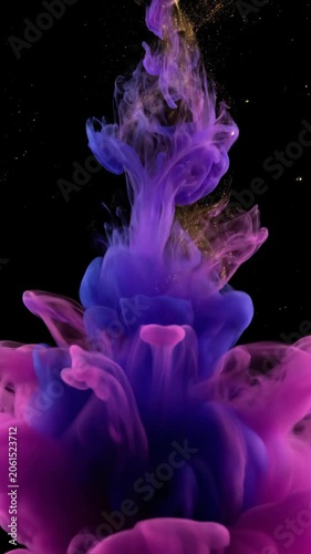Colorful purple ink splash swirling in dark water background