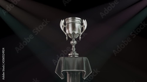 Trophy cup silver award marking a second place runner-up zooming in a CG animation against dark spotlights. Esports tournament finals, corporate recognition, sports competition awards.