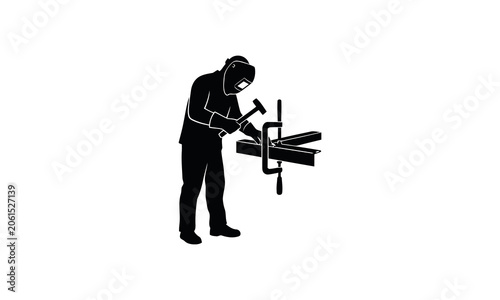 Fotografie Silhouette of a person cutting wood with a handsaw