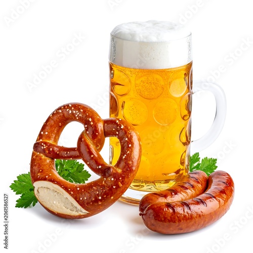 A refreshing beer in a glass with a pretzel and sausage