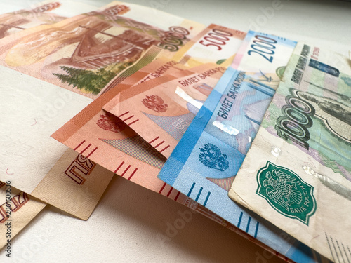 Bild auf Leinwand Various denominations of Russian roubles arranged on a flat surface for financia