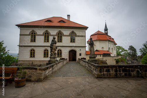 Exterior of Valdstejn Castle (Hrad Valdstejn) in Hruba Skala, Bohemian Paradise (Cesky raj), Czech Republic. historic sandstone castle exterior overlooking valley forest landscapes