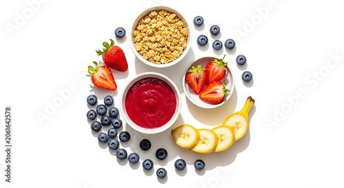 Healthy breakfast flatlay with strawberries blueberries bananas and granola