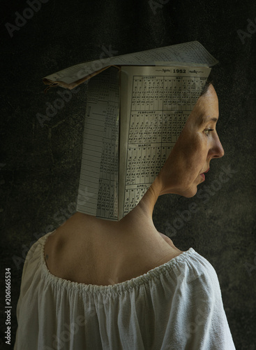 artistic portrait of a woman with a paper hat made of calendars III