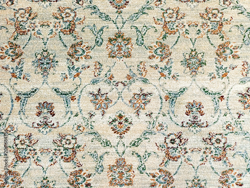 Vintage floral carpet texture background with classic damask ornament pattern. Abstract grunge rustic floor rug fabric backdrop for design copy space.