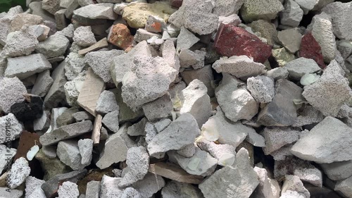 Pile of construction debris with broken bricks and concrete rubble