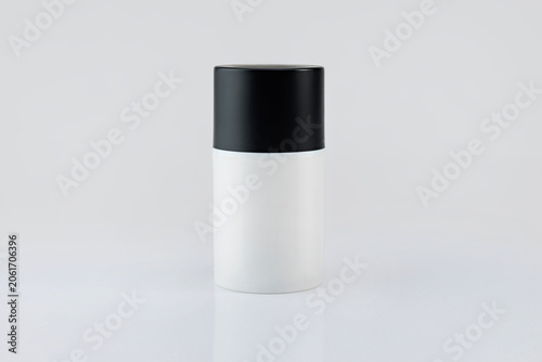 Bottle with cap on white