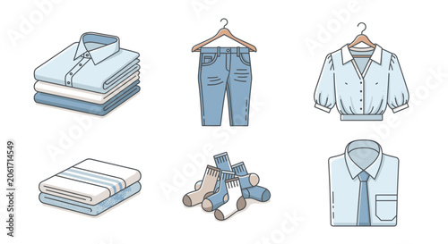 A collection of neatly arranged clothing items on hangers and folded on a surface
