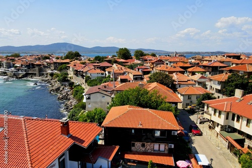 Historic old houses with red tiled roofs, architecture on Black Sea coast. Old town of Nessebar, Bulgaria, Panorama, view from drone