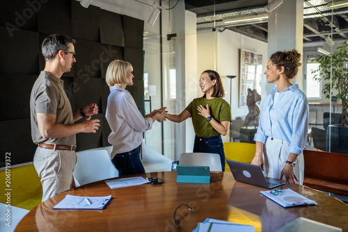 фотографія Businesswomen shaking hands welcoming a new team member