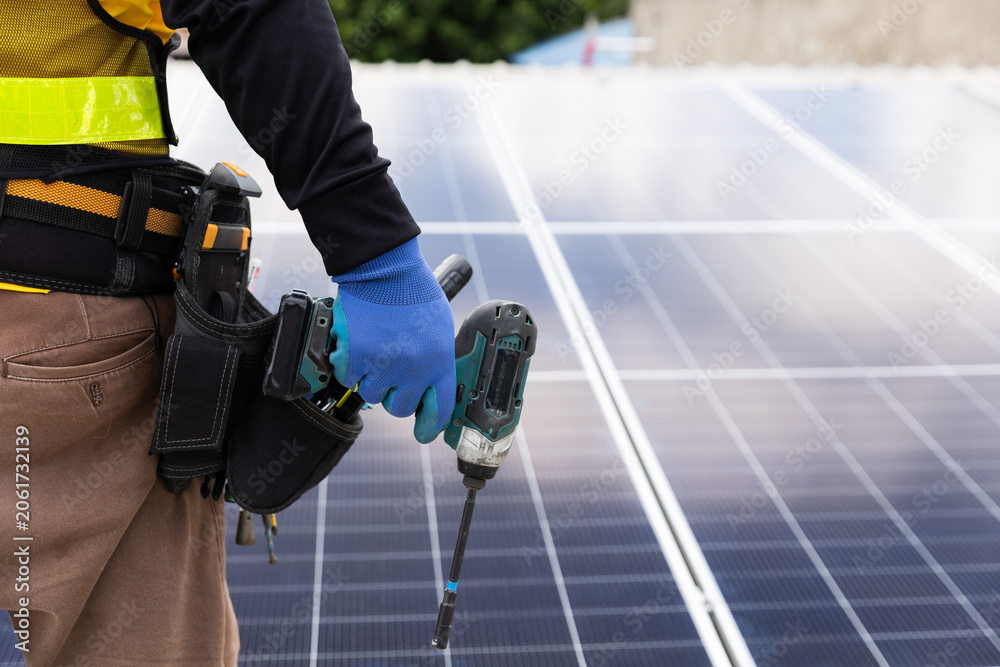 Obraz premium Solar panel installation action by technician rooftop location industry content urban environment close-up viewpoint renewable energy concept