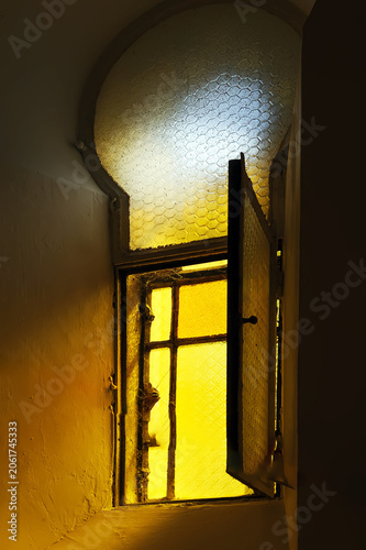 Light coming through window into the dark room