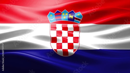 Croatian coat of arms emblem on national flag waving against cloudy sky background