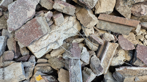 Cuadro en lienzo A chaotic pile of construction debris, featuring broken concrete blocks, shattered asphalt pieces, stone fragments, and exposed rebar