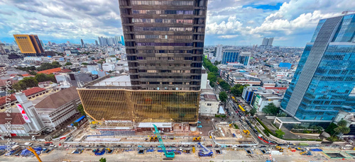 Fotografie Urban landscape of Harmoni Jakarta featuring ongoing MRT construction, modern high rise buildings, and major transportation infrastructure development shaping the future of the metropolitan city