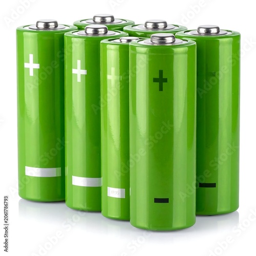 A set of six green cylindrical batteries with metal tops and colored polarity markings