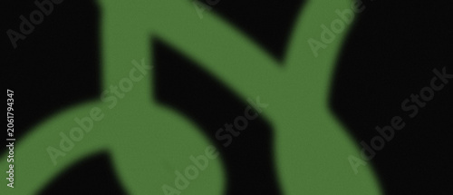 Abstract green curved lines on dark background creating an artistic visual effect, flowing organic shapes.