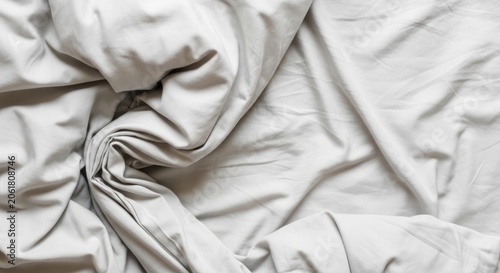 Rumpled grey bed sheets fabric texture background.